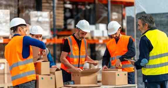 warehouse workers packing boxes