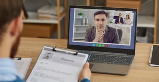hr manager reviewing candidate profile to prevent hiring fraud using vms (1200 x 628 px)