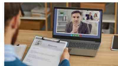 candidate-being-interviewed-on-computer-representing-candidate-fraud-risk-card 400-225-11