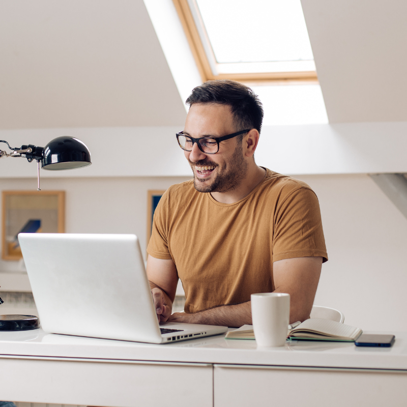 Happy worker on laptop